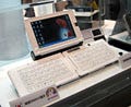 WIRELESS JAPAN 2008 - ソリューション展示が中心のKDDIブース