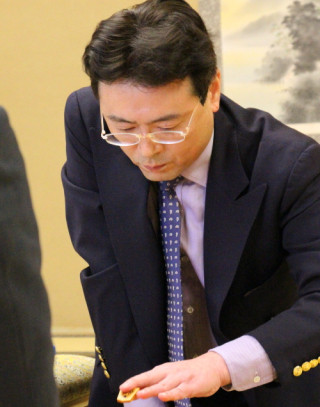 泥にまみれた塚田九段が譲れなかったもの -『将棋電王戦』第四局 "棋士の意地"すら超えた、勝負への壮絶な執念